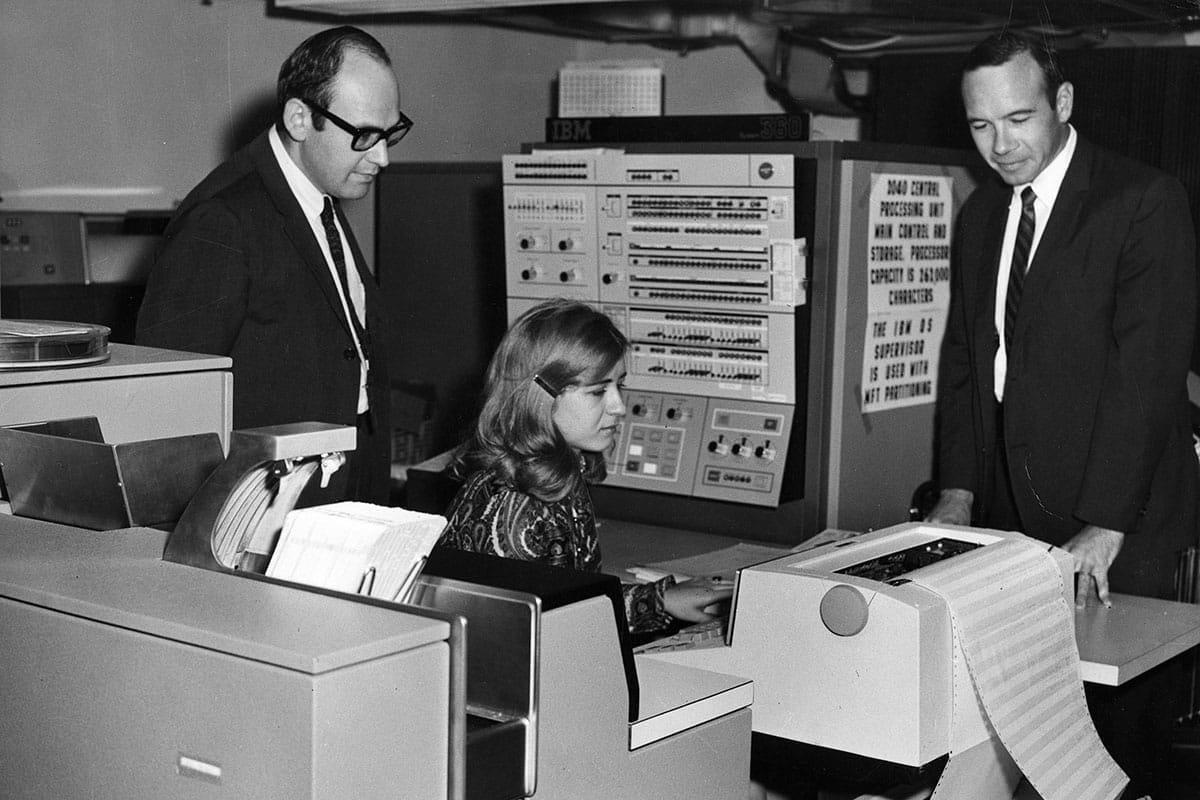 Irwin Pizer and others observe the Biomedical Communications Network terminal. This was the first online bibliographic network for medical literature in the world and was established at the Upstate Health Sciences Library in 1968 (1968)